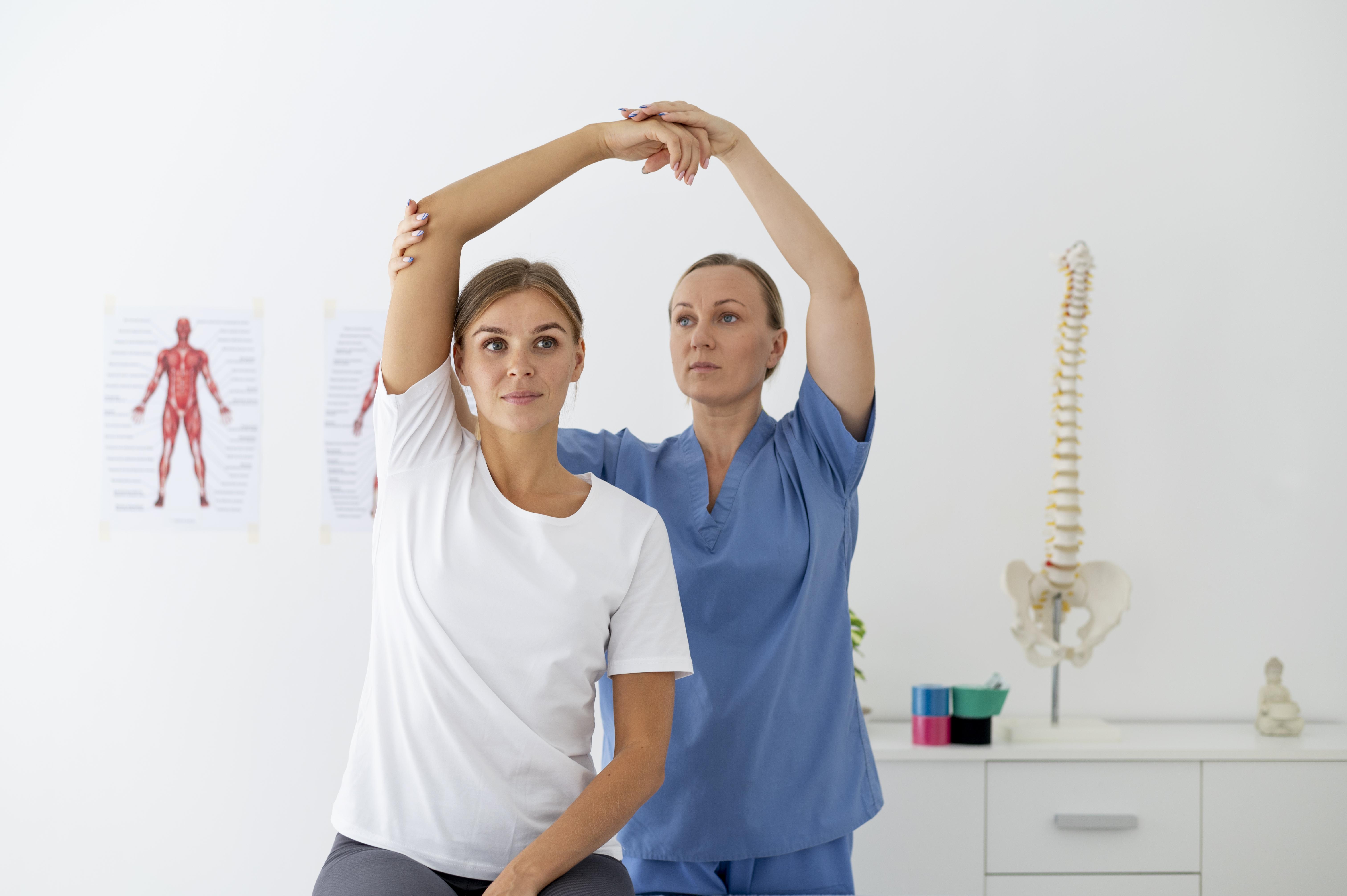 Physiotherapist guiding a shoulder mobility assessment